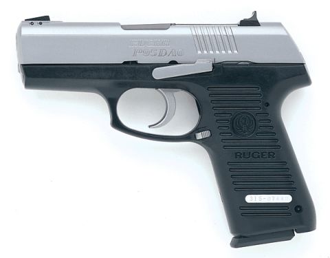 1986 Ford LTD Crown Victoria - A Kahr CW9 pistol is shown against a white background.