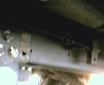 1984 Ford Bronco - Close-up view of a vehicle's undercarriage, a Supermotors.net watermark.