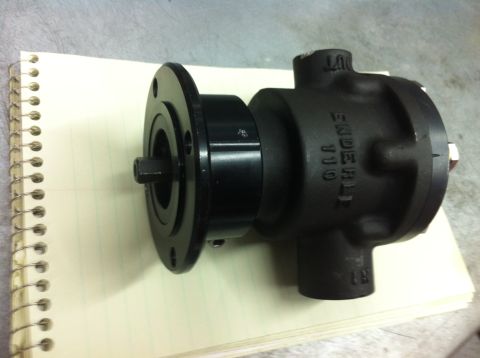 1965 Ford Fairlane - A black automotive part, possibly a fuel pump, is shown on a notebook. Text visible on the part reads 'ENDERLE 110'.