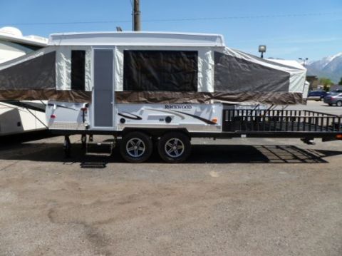 1984 Ford Bronco - This Rockwood toy hauler features a pop-up section and a ramp for hauling recreational vehicles.