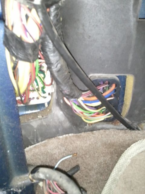 1994 Ford Bronco - Vehicle interior wiring harness with numerous colorful wires visible.