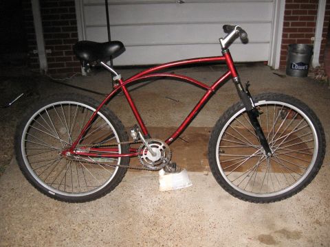 1994 Ford Bronco - A red cruiser bicycle is shown in a side profile, wide tires and a distinctive curved frame.