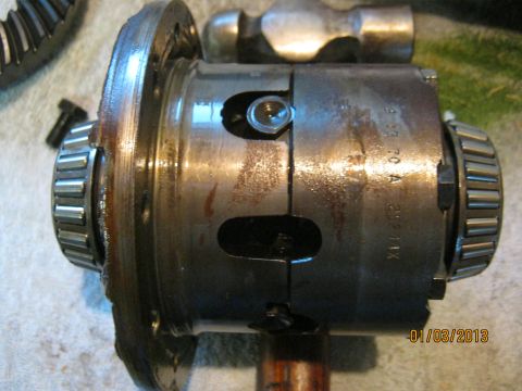 1970 Ford Bronco - Close-up of a differential carrier, possibly from a 1970 vehicle, with visible roller bearings and gear teeth.