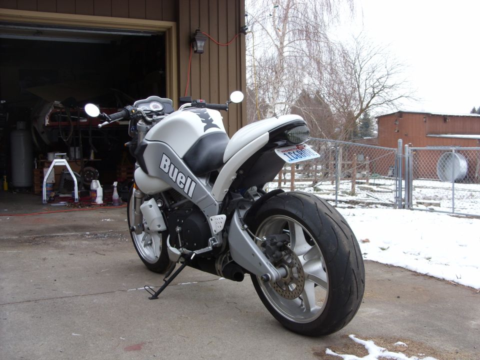 White Buell motorcycle rear view with 'Buell' text on the side