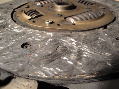 1992 Ford Taurus - Close-up of a worn clutch disc, showing the friction material and springs.
