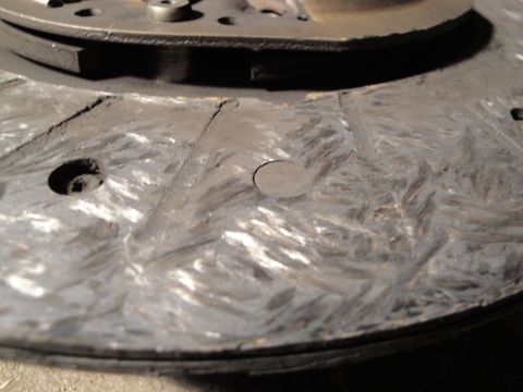 1992 Ford Taurus - Worn clutch disc showing signs of scoring and accumulated dust.