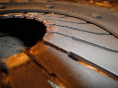1992 Ford Taurus - Damaged clutch disc with severely worn and torn friction material.