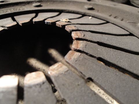 1992 Ford Taurus - Close-up of a worn clutch disc, showing damage to the friction material.