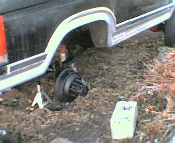 1984 Ford Bronco - Rear axle assembly of a 1984 Ford Bronco removed for service, showing suspension components.