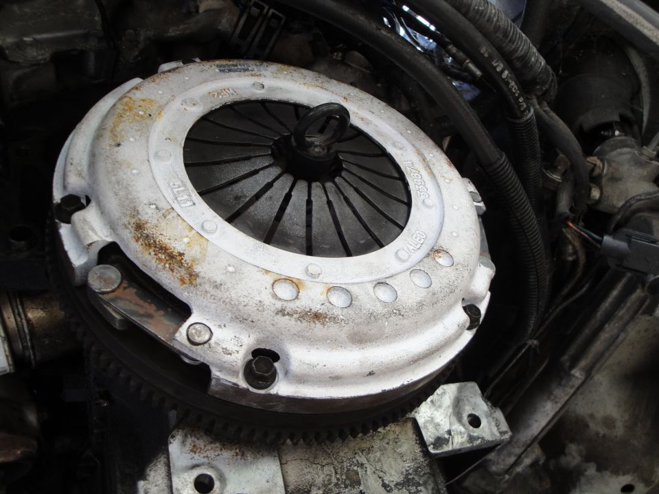 close-up of car clutch assembly with visible part numbers
