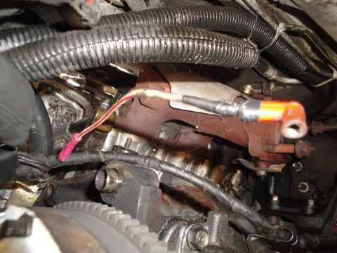 1992 Ford Taurus - Close-up view of a vehicle's engine clutch assembly, showing various components and wiring.