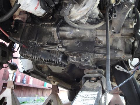 1992 Ford Taurus - Underside view of a vehicle's engine and transmission assembly, showing the oil pan and other components.