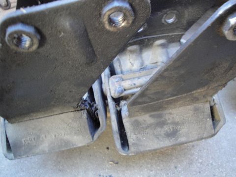 1992 Ford Taurus - Worn engine mounts show signs of deterioration, with visible text on the rubber components.