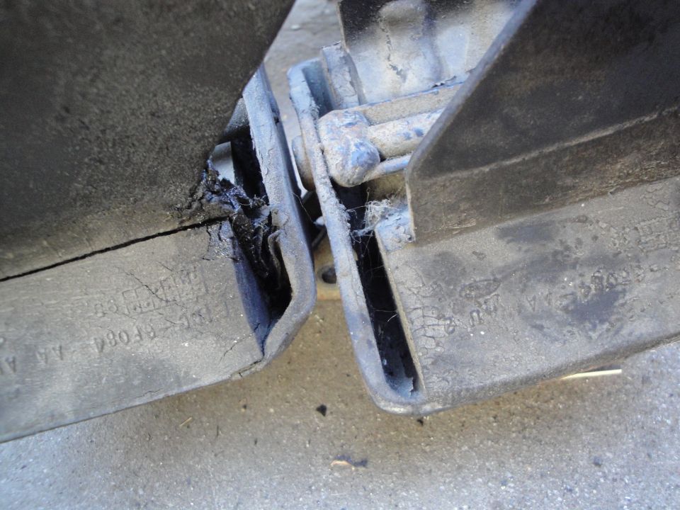 worn rubber bumper components with visible part numbers