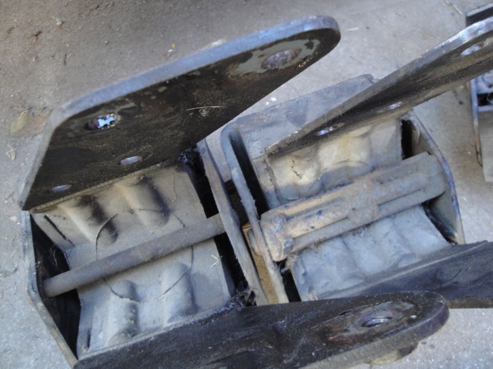 Rubber engine mounts with metal brackets. Some are cracked
