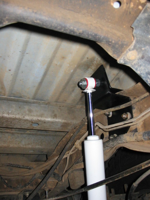 1995 Ford Bronco - Inside plate comes together with outside plate above the frame, where a hole was drilled for the shock stud mount.