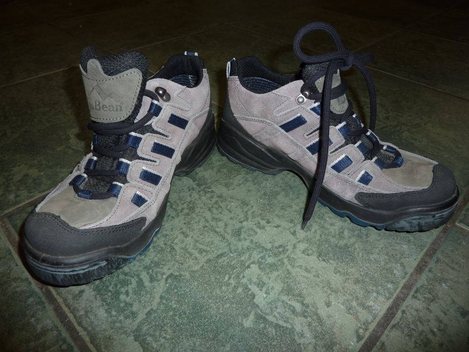 Pair of gray and blue hiking boots with black laces, one boot has a 'Bean' logo