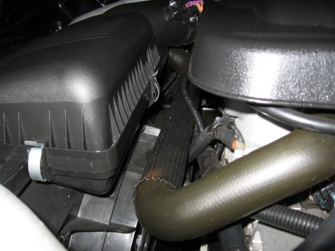 1995 Ford Bronco - Engine bay details including air intake and various hoses.