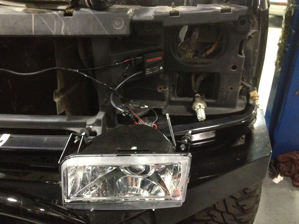 Headlight assembly with wiring and ballast, angled from front