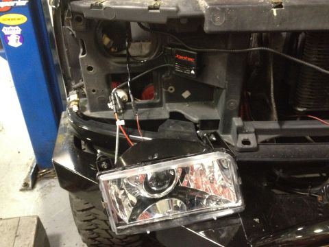 1995 Ford Bronco - Headlight assembly with XenTec ballast and wiring, likely for a vehicle modification.