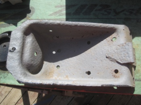 1993 Ford Bronco - This is a metal bracket with various holes and mounting points visible.