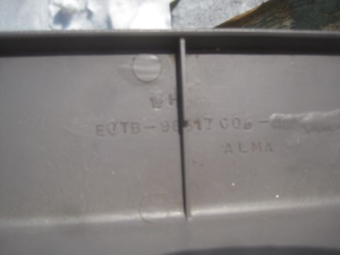 1993 Ford Bronco - Close-up of a gray plastic part showing embossed text and a part number.
