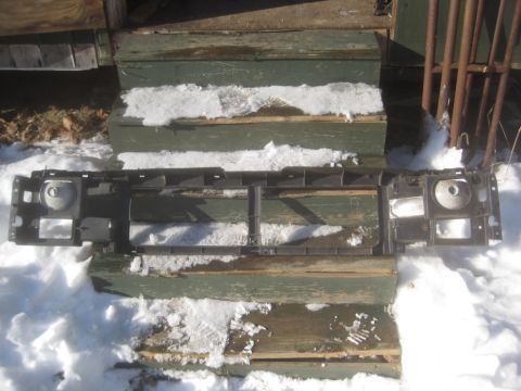 1993 Ford Bronco - Grille support assembly for a 1993 Ford Bronco, shown outdoors in the snow.