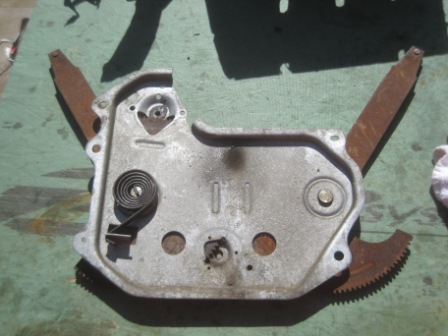 1993 Ford Bronco - Close-up of a disassembled window regulator mechanism, showing internal components.