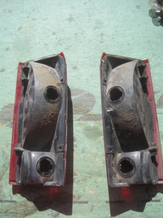 1993 Ford Bronco - Rear view of two used tail light assemblies, likely for a truck or SUV, with visible mounting hardware and connectors.