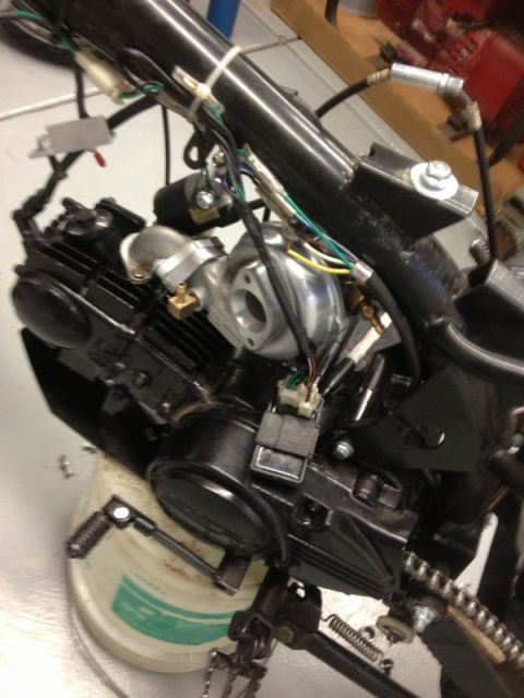2003 Ford Crown Victoria - Close-up view of a motorcycle engine assembly, showing engine block, wiring, and turbo components.