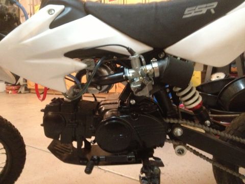 2003 Ford Crown Victoria - Close-up view of a motorcycle's engine and seat area, showing mechanical components and branding.
