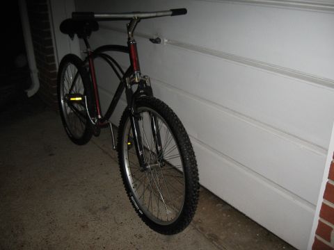 1994 Ford Bronco - A bicycle is parked in front of a white garage door.