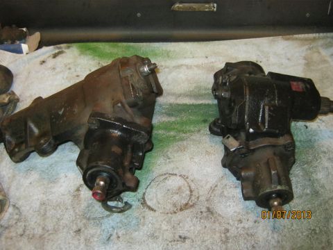 1970 Ford Bronco - Comparison of two steering gearboxes, one showing significant rust and the other appearing recently painted.