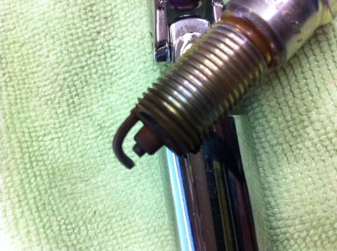 2010 Dodge Challenger - This spark plug appears to be worn out and may need replacement.