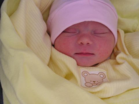 1994 Ford F-150 - A baby sleeps soundly in a yellow blanket, wearing a pink hat. The "SUPERMOTORS" logo is visible in the corner.