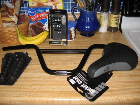 1994 Ford Bronco - New bicycle parts are laid out on a kitchen counter, ready for installation.