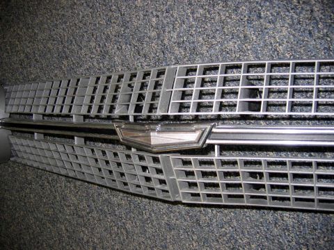 1971 Ford Ranchero - A close-up view of a vehicle's front grille and emblem.