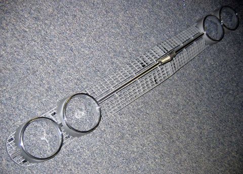 1971 Ford Ranchero - Front grille assembly for a 1971 Ford Ranchero, a horizontal bar and mesh pattern.