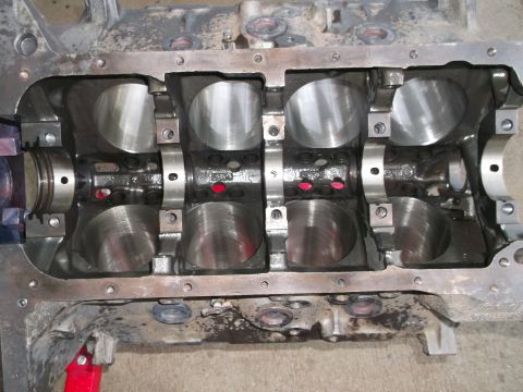 1965 Shelby Cobra - Close-up view of an engine block, showing internal components and visible text from a website.