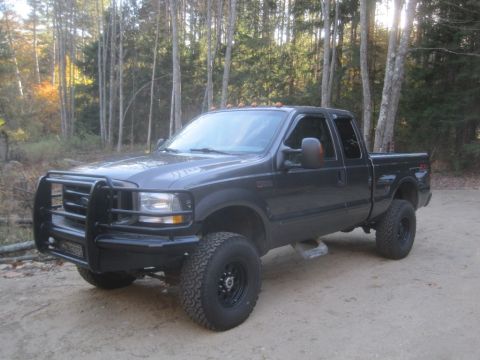 2003 Ford F-350 - This lifted 2003 Ford F-350 pickup truck is equipped with a heavy-duty brush guard and off-road tires.