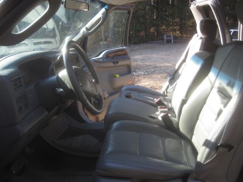 2003 Ford F-350 - Interior view of a 2003 Ford F-350, highlighting the front seating and dashboard area.