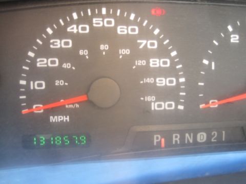 2003 Ford F-350 - The vehicle's odometer reads over 131,000 miles, and the gear selector is in Park.