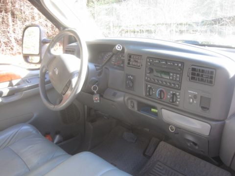 2003 Ford F-350 - The interior of a Ford F-350 pickup truck, the dashboard and driver's seat.