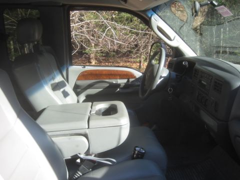 2003 Ford F-350 - Interior view of a 2003 Ford F-350, showing the dashboard, steering wheel, and seating area.