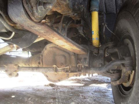 2003 Ford F-350 - Undercarriage of a 2003 Ford F-350, highlighting suspension components and the rear differential.