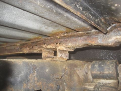 2003 Ford F-350 - Significant rust and corrosion are visible on the vehicle's undercarriage, indicating potential structural weakness.