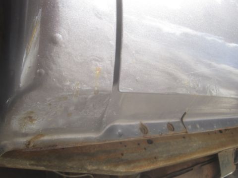 2003 Ford F-350 - Rust is visible on the lower body panel and frame of this truck.