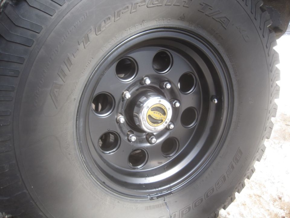 Black steel wheel with chrome hub and BFGoodrich All-Terrain T/A tire