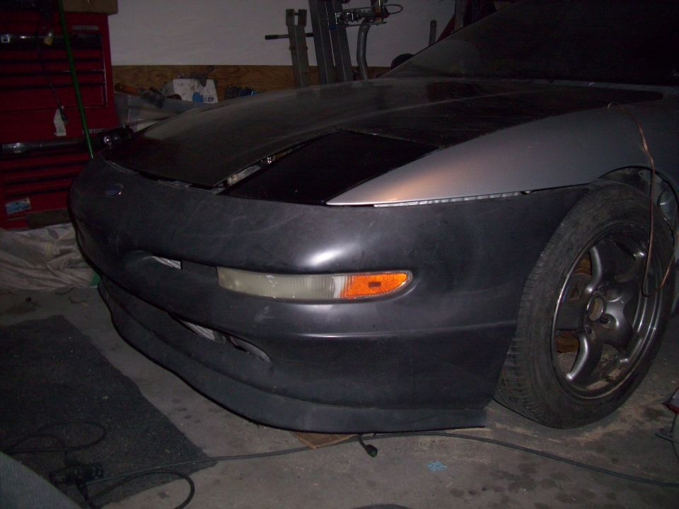 1995 Ford Probe front bumper and fender assembly, partially installed