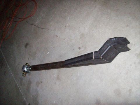 1988 Ford Bronco - A fabricated suspension component, possibly for off-road use, is shown lying on a concrete surface.